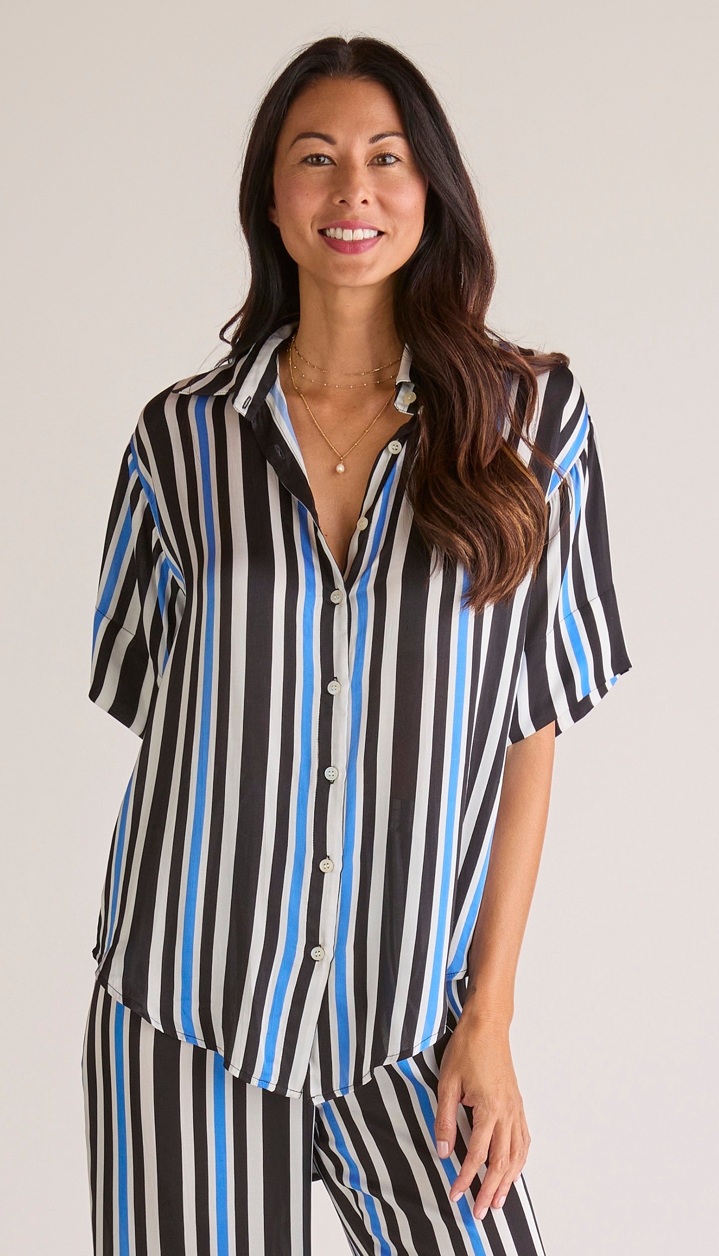 Solune Boyfriend Stripe Set — Relaxed satin loungewear set with oversized collared button-down shirt and tailored straight-leg pants