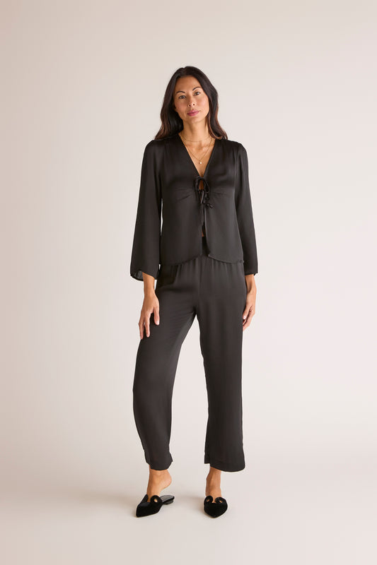 The Sōlune Muse Set Black — chic black satin resortwear set with Y2K-inspired lace-up blouse and satin lounge pants